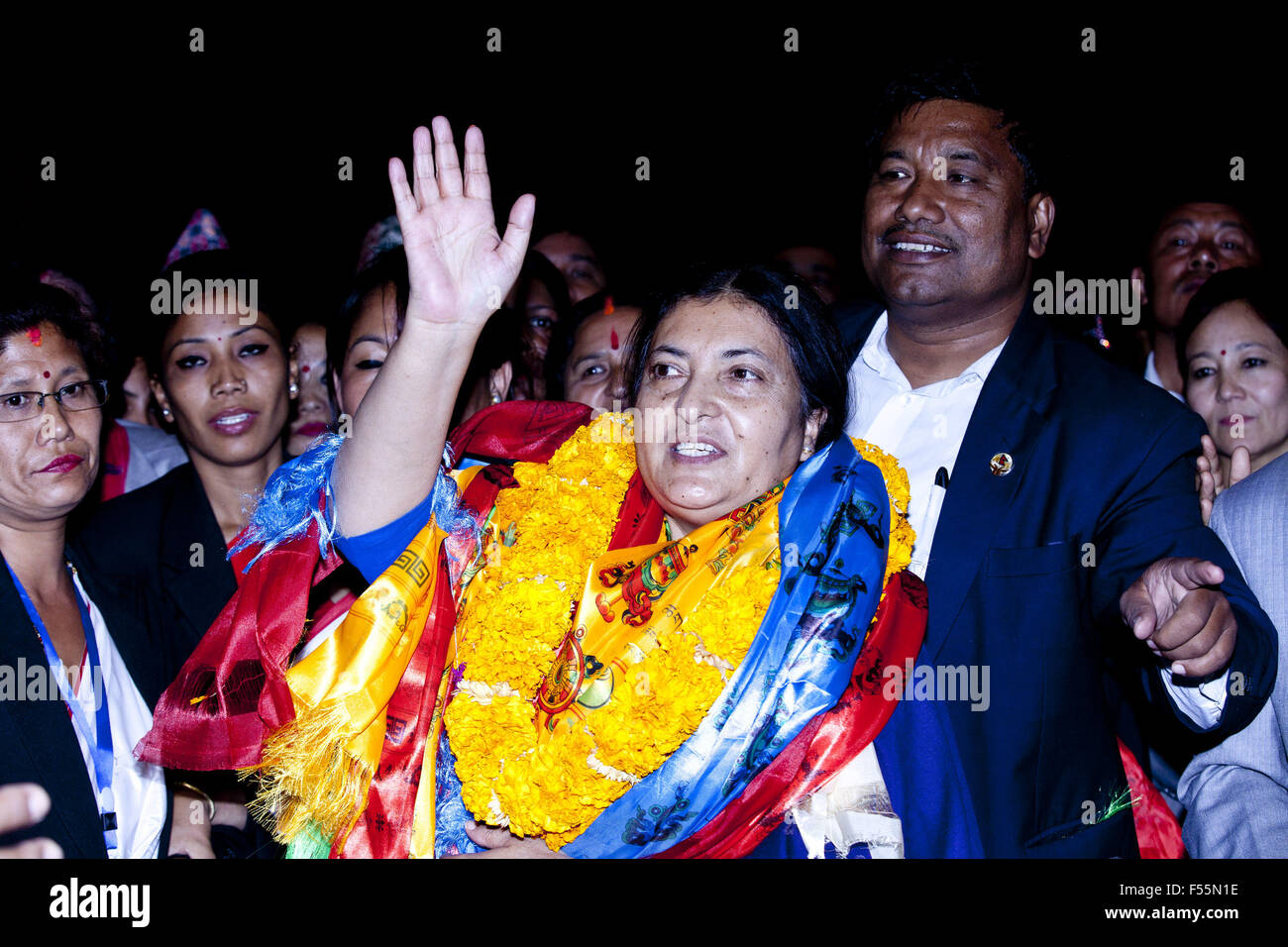 (151028) -- KATHMANDU, Oct. 28, 2015 (Xinhua) -- Bidhya Devi Bhandari (C), Vice Chairperson of the Communist Party of Nepal (Unified Marxist-Leninist), gestures after winning the election at the Legislature-Parliament house in Kathmandu, Nepal, Oct. 28, 2015. Nepal's CPN (UML)'s Vice President Bidhya Devi Bhandari has been elected as the first female president of Nepal on Wednesday, the first time in the history of the patriarchy-backed Himalayan nation to grace the title of head of state to any woman. (Xinhua/Pratap Thapa) Stock Photo