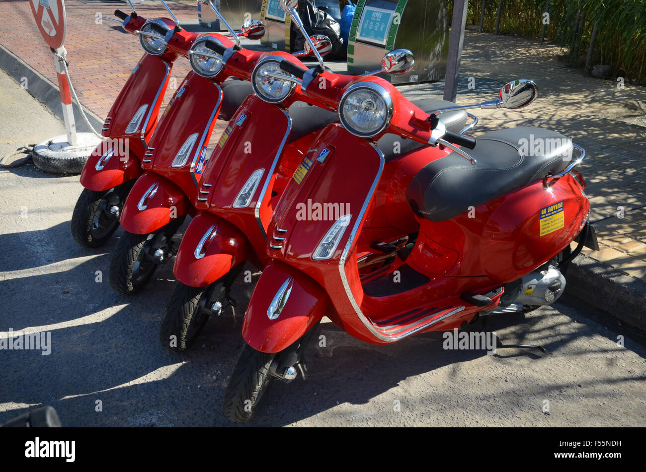 line up of rental scooters, Formentera Spain Stock Photo Alamy