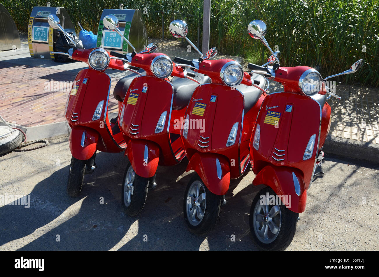 line up of rental scooters, Formentera Spain Stock Photo Alamy