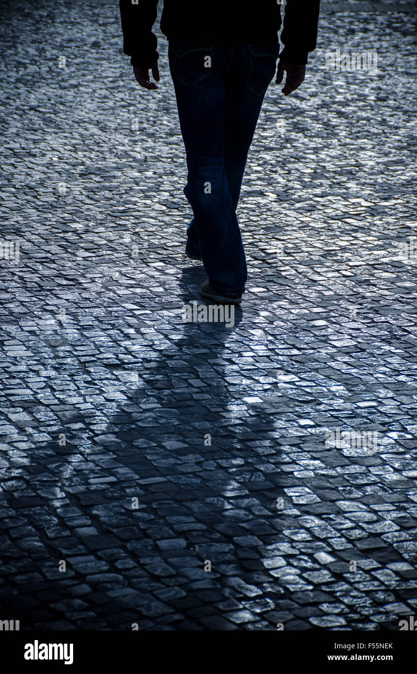 Shadowy man walking hi-res stock photography and images - Alamy