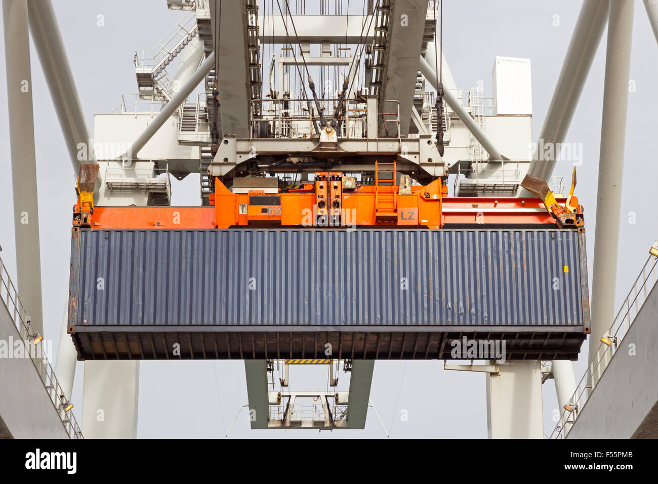 Sea container lifted by a harbor crane Stock Photo