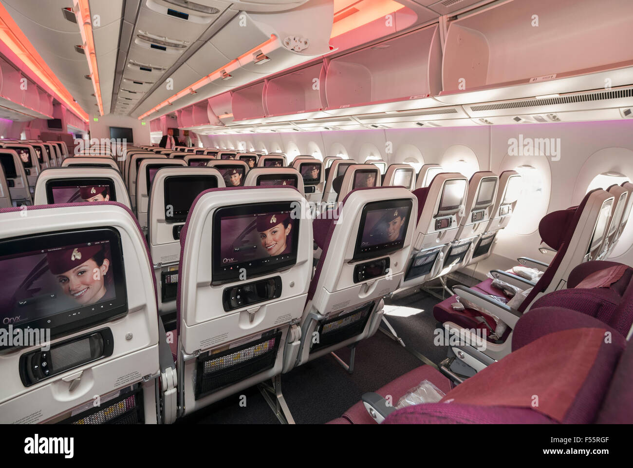 Economy class seats in a Qatar Airways Airbus A350 XWB Stock Photo