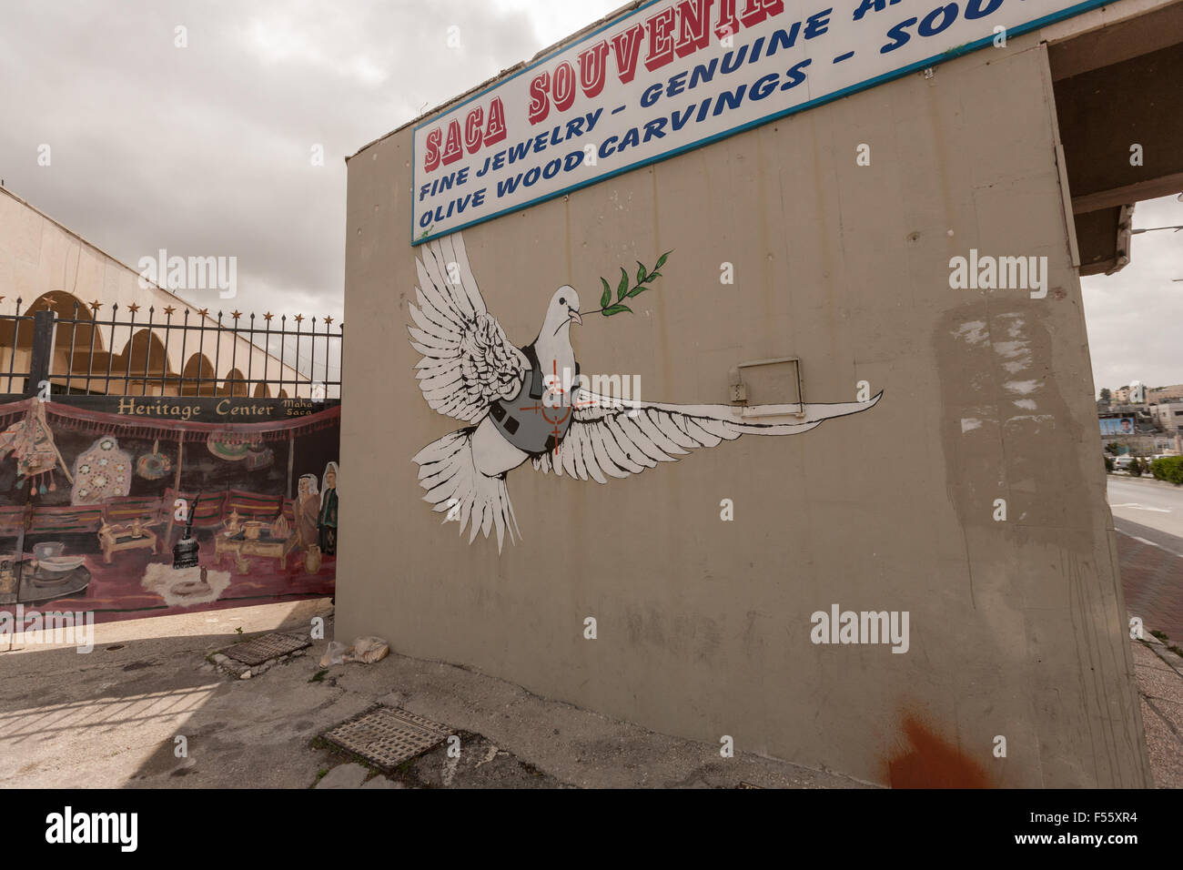 Graffiti West Bank Dove of Peace wearing bullet proof vest Stock Photo