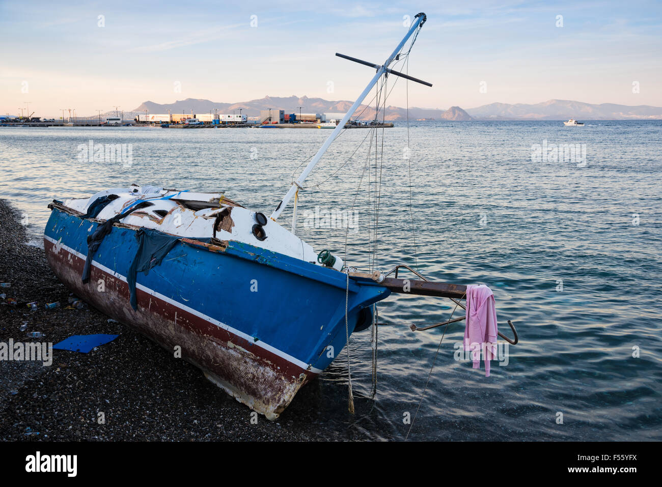 Damaged ship of refugees on October 14, 2015 in the harbor of Kos island, Greece. Stock Photo