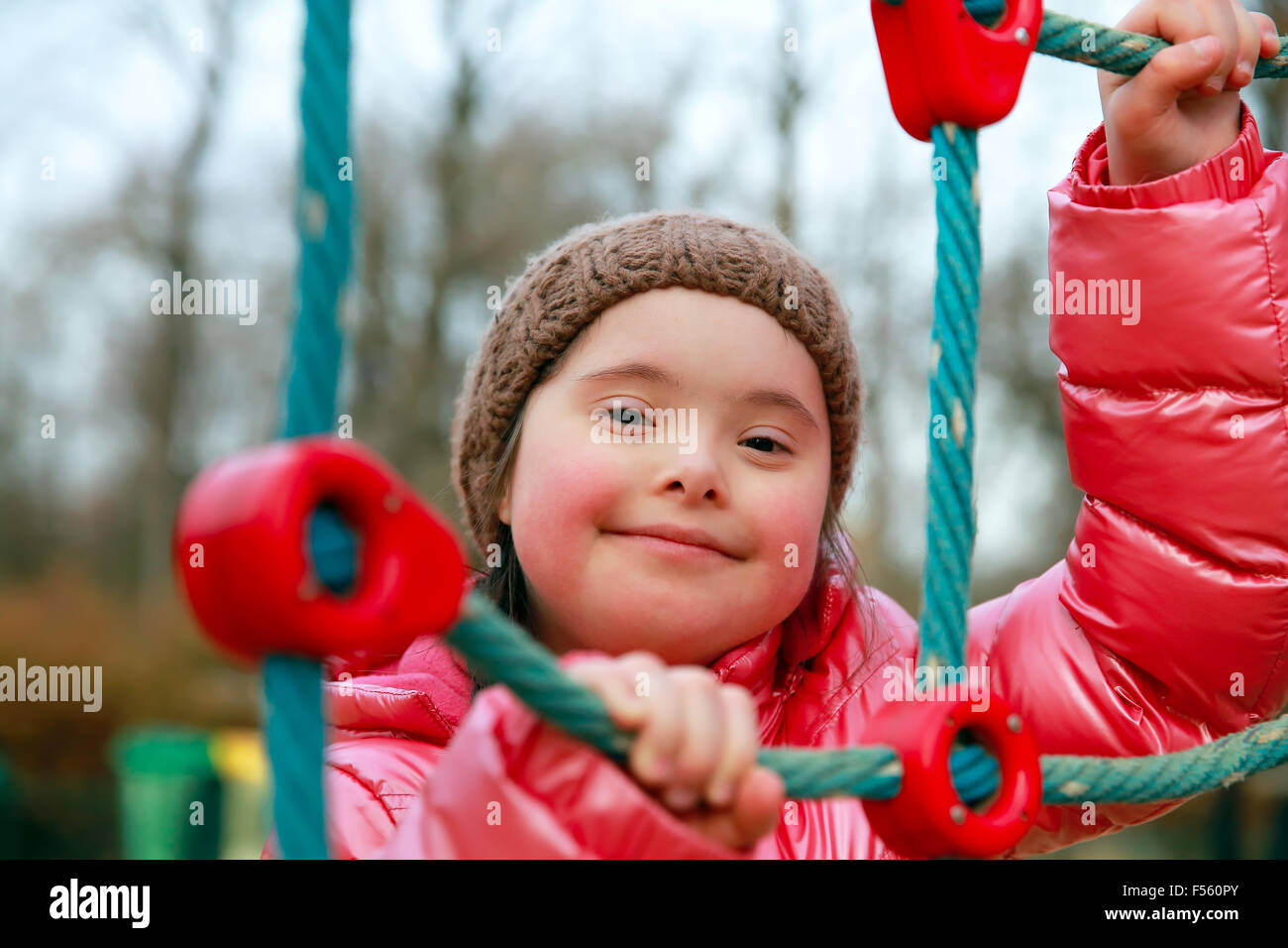 Portrait of beautiful girl on the playground Stock Photo - Alamy