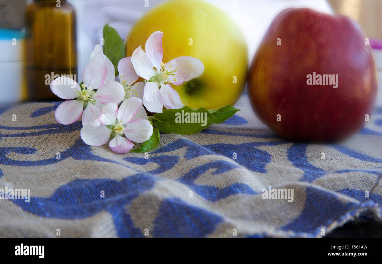 Apple blossoms.Apples and dropper bottles in the background Stock Photo