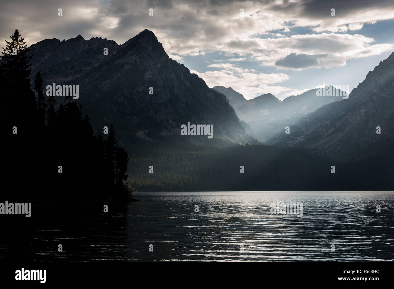 Sunlight breaking through clouds over Paintbrush Canyon and Leigh Lake, Grand Teton National Park, Wyoming Stock Photo