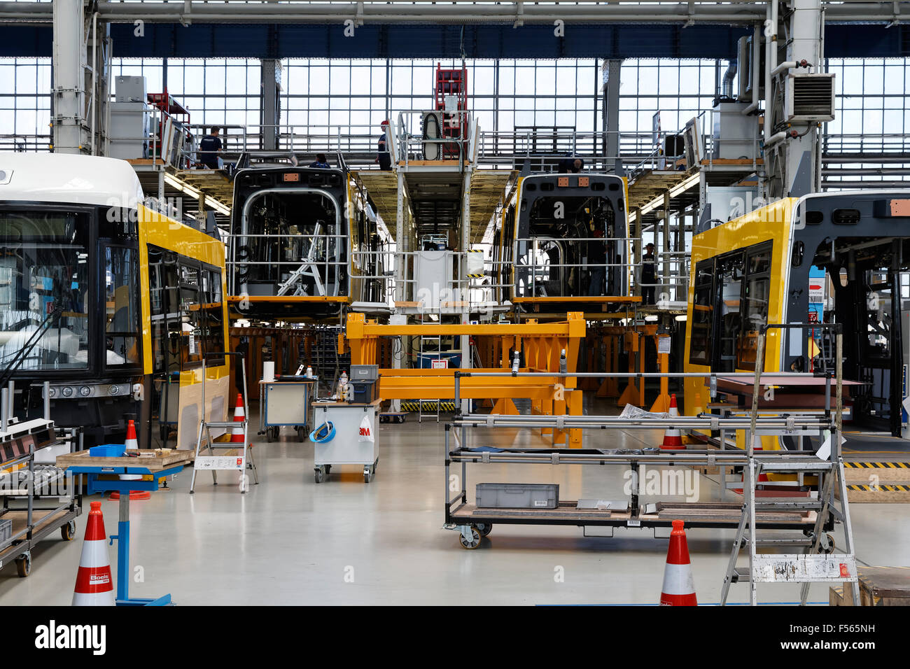 04.06.2015, Hennigsdorf, Brandenburg, Germany - Rolling stock production in Bombardier Transportation in Hennigsdorf Brandenburg plant. The picture shows the production hall with EMUs type Talent 2 for regional traffic. In the foreground car bodies for FLEXITY trams to the BVG BVG. EJH150604D614CAROEX.JPG - NOT for SALE in G E R M A N Y, A U S T R I A, S W I T Z E R L A N D [MODEL RELEASE: NOT APPLICABLE, PROPERTY RELEASE: NO (c) caro photo agency / Heinrich, http://www.caro-images.pl, info@carofoto.pl - In case of using the picture for non-journalistic purposes, please contact the agency - th Stock Photo