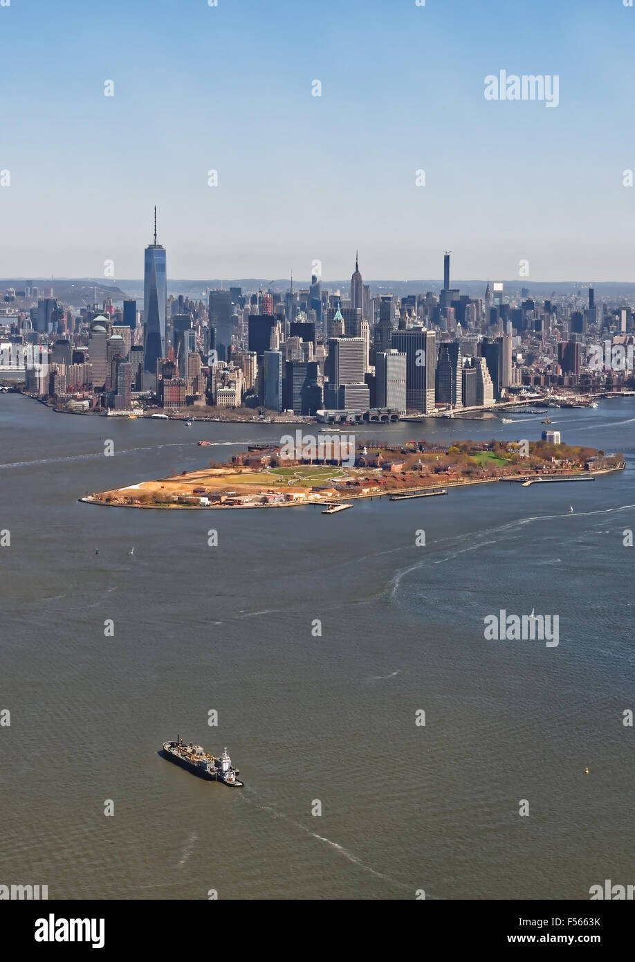 Aerial view of Manhattan with Governors Island in the foreground, New York, USA. Located in Upper New York Bay, Governors Island is home to historical fortifications Fort Jay and Castle Williams Stock Photo