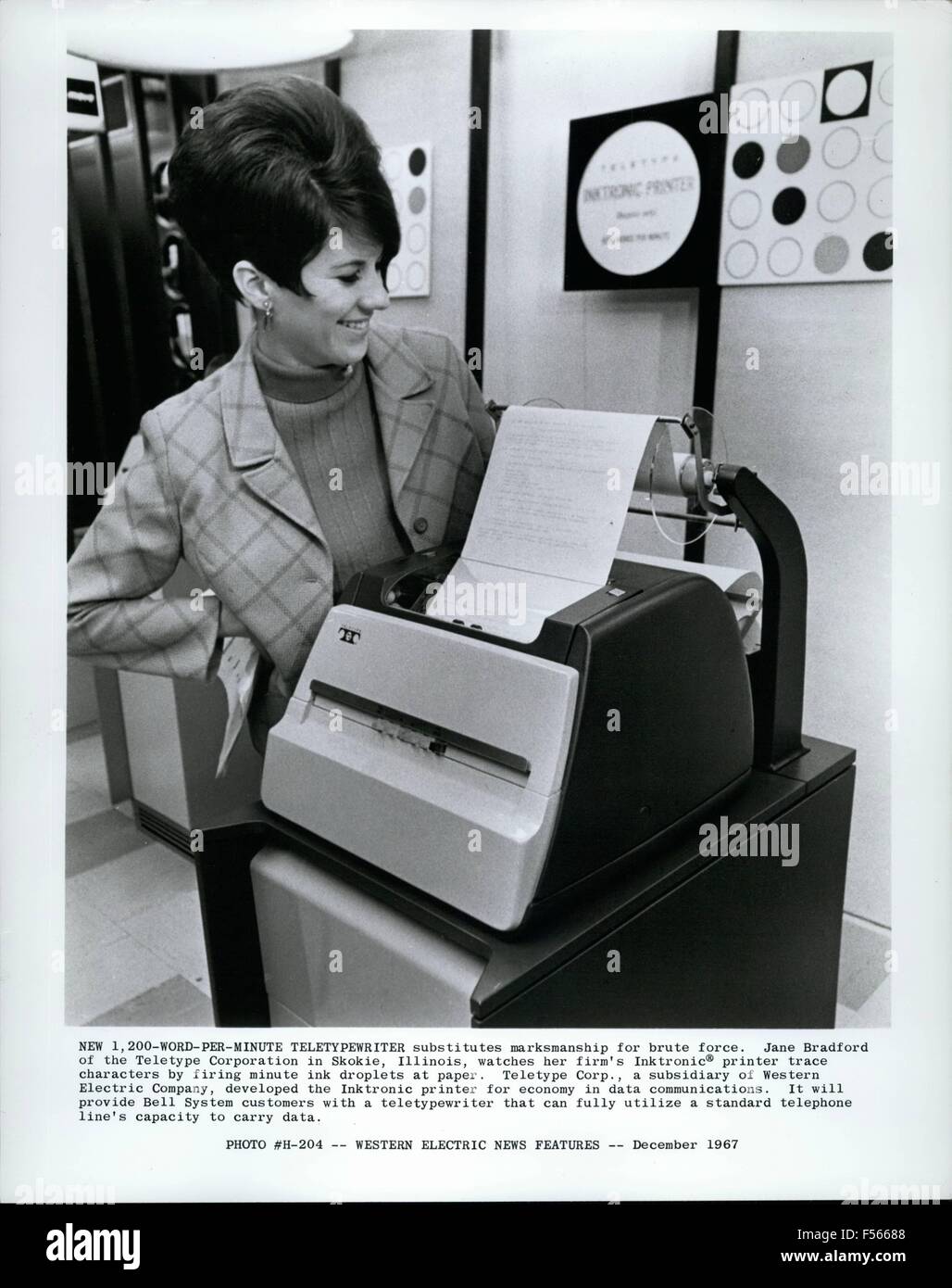 1968 - New 1-200 Word per minute teletypewriter substitutes marksmanship for brute force. Jane Bradford of the teletype corporation in Skokie, Illinois, watches her firm's Inktronic printer trace character by firing minute ink droplets at paper. Teletype Corp., a subsidiary of Western Electric Company, developed the Inktronic printer for economy in data communications. It will provide Bell Systems customers with a teletypewriter that can fully utilize a standard telephone lines capacity to carry data. (Credit Image: © Keystone Pictures USA/ZUMAPRESS.com) Stock Photo