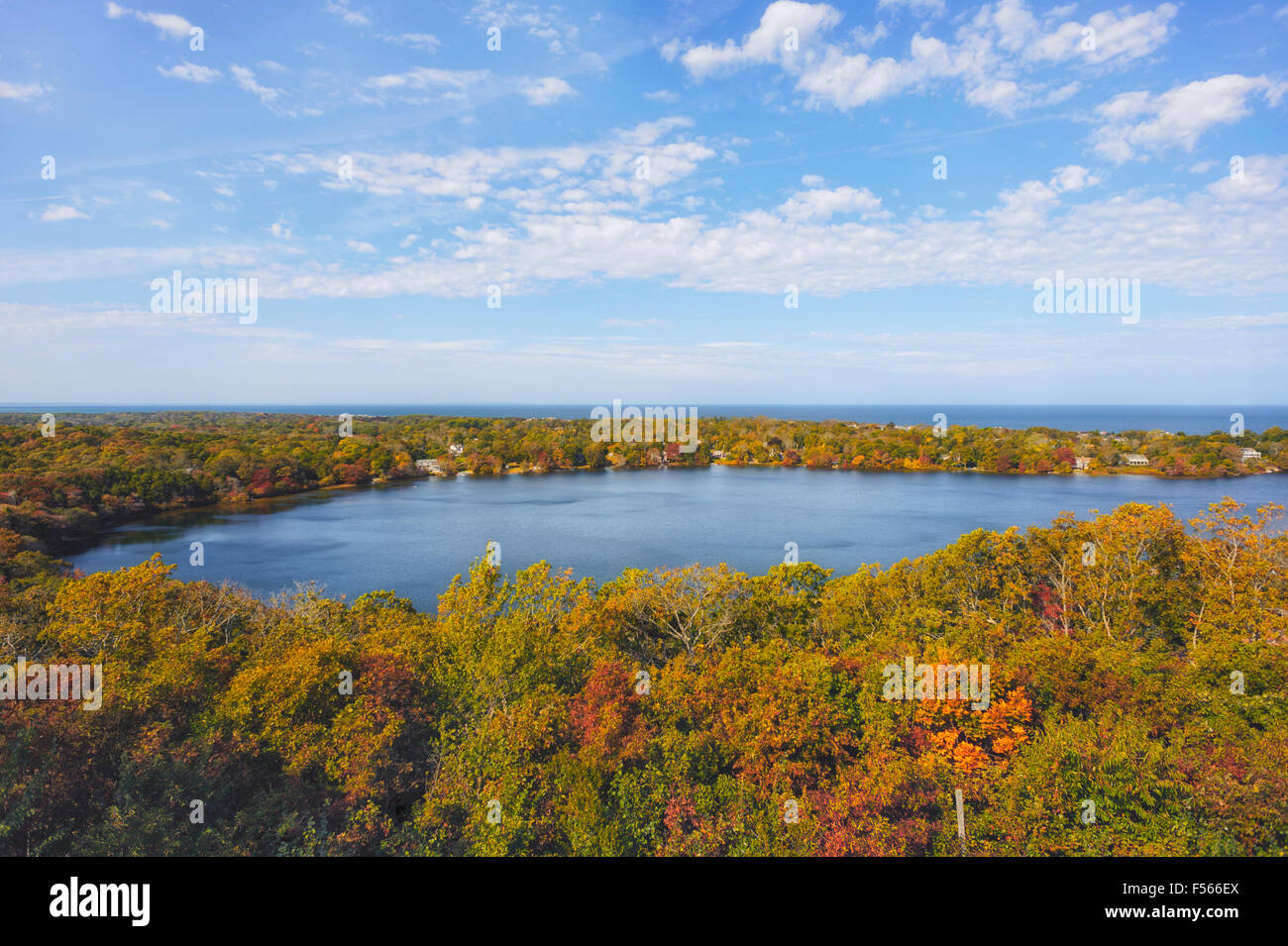 Birds eye view Scargo Lake and Cape Cod Bay with fall foliage seen from Scargo Tower Dennis Cape Cod Massachusetts, blue sky Stock Photo