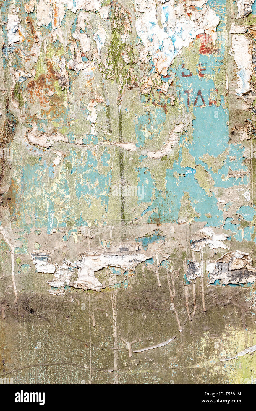 Texture of torn advertisement on an old wall Stock Photo