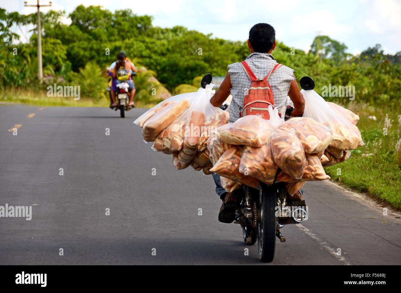 Delivery motorbike road hi-res stock photography and images - Alamy