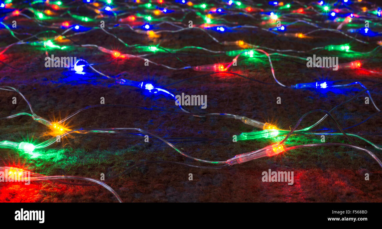 Festoon of the colour lights on dark background close-up Stock Photo