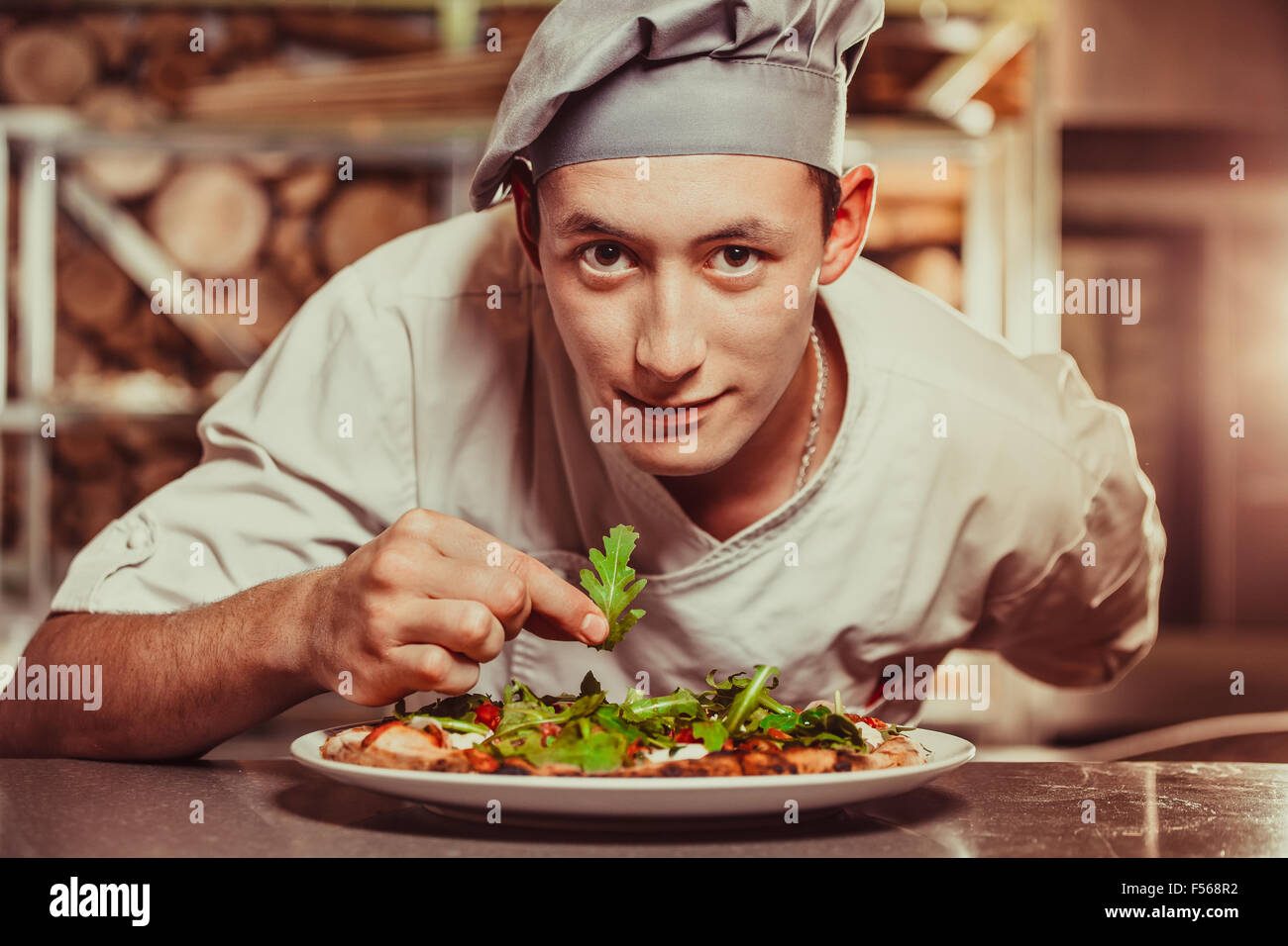 male cook preparing delicious appetizer Stock Photo