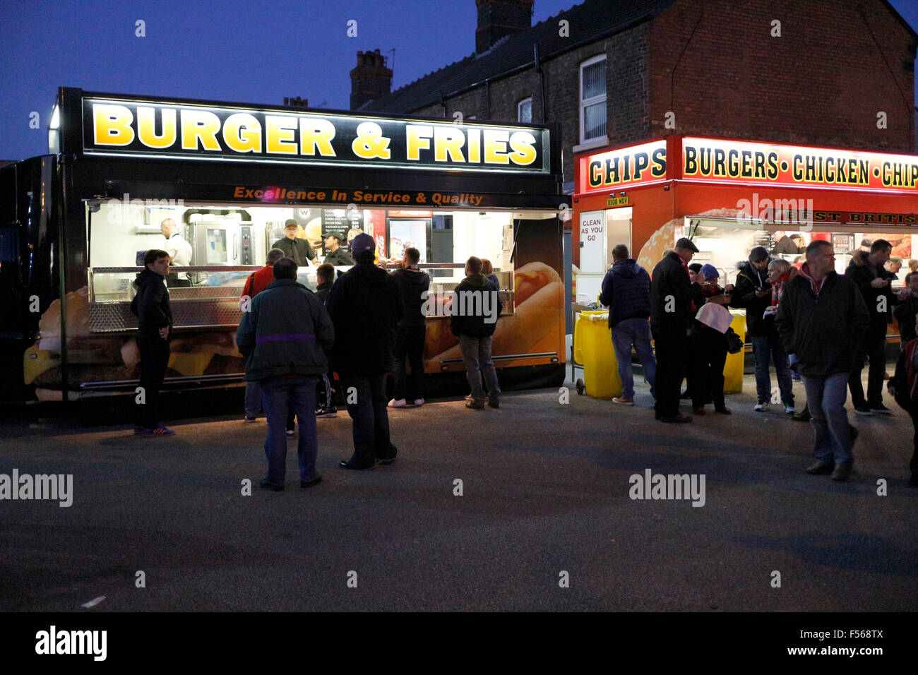 burger and fast food stalls at night outside a football ground Liverpool England UK Stock Photo