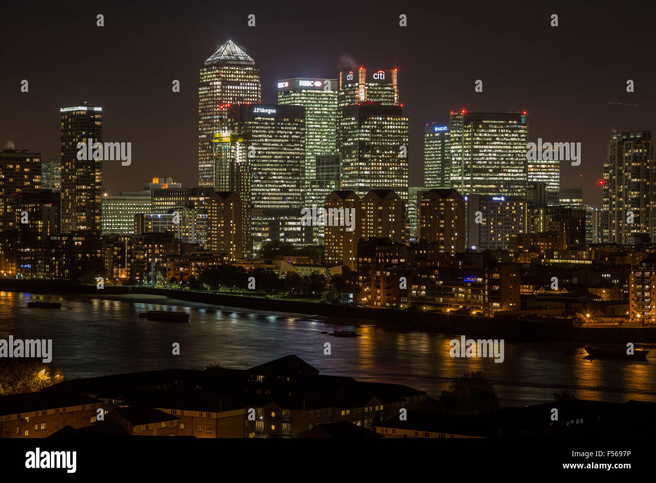 London, UK. 28th Oct, 2015. Canary Wharf business park buildings and River Thames seen at night Credit:  Guy Corbishley/Alamy Live News Stock Photo
