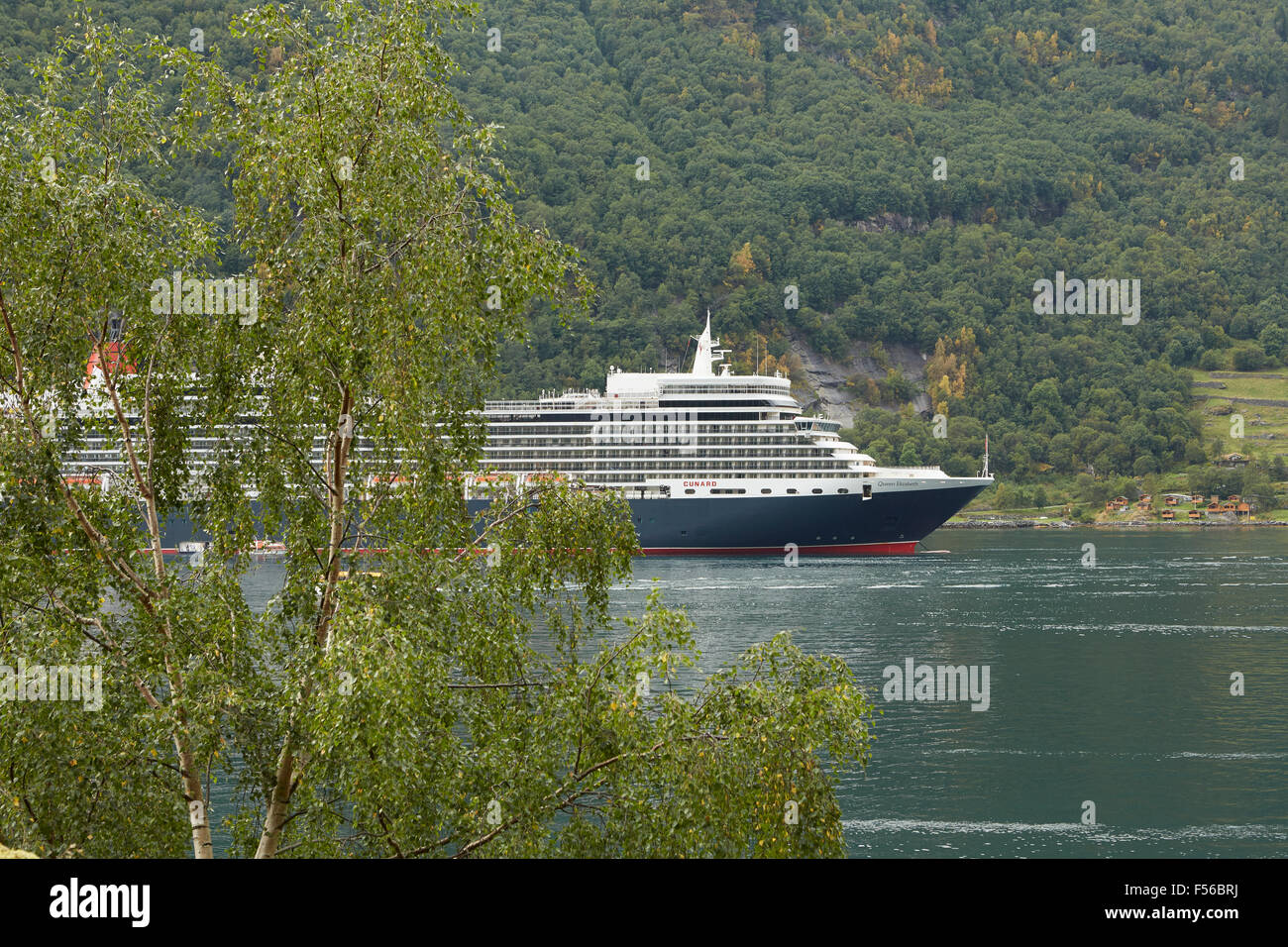MS Queen Elizabeth II, Moored In Geiranger Fjord, Norway. Stock Photo