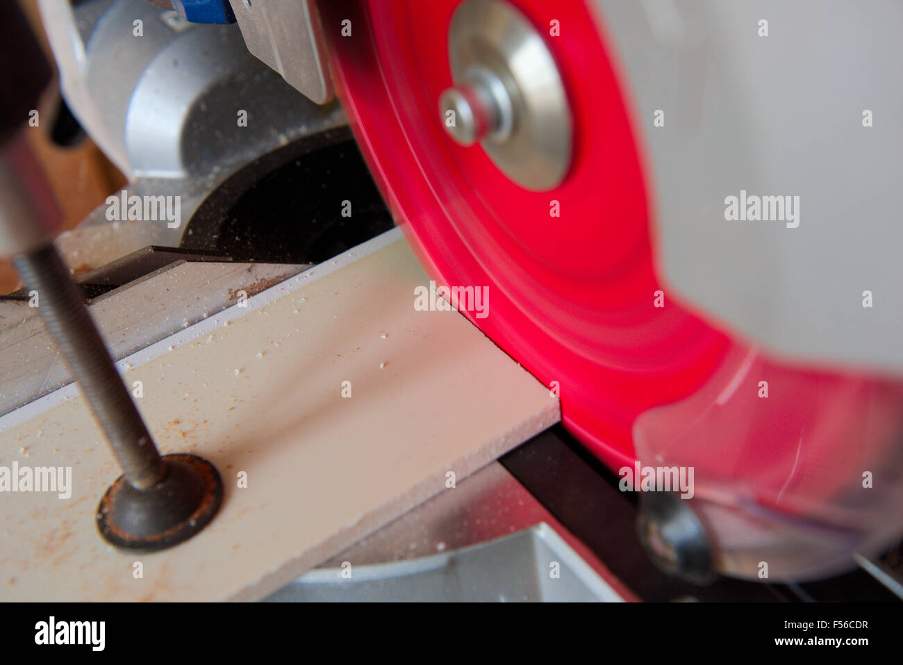 Circular power saw cutting section of plastic soffit board Stock Photo Alamy