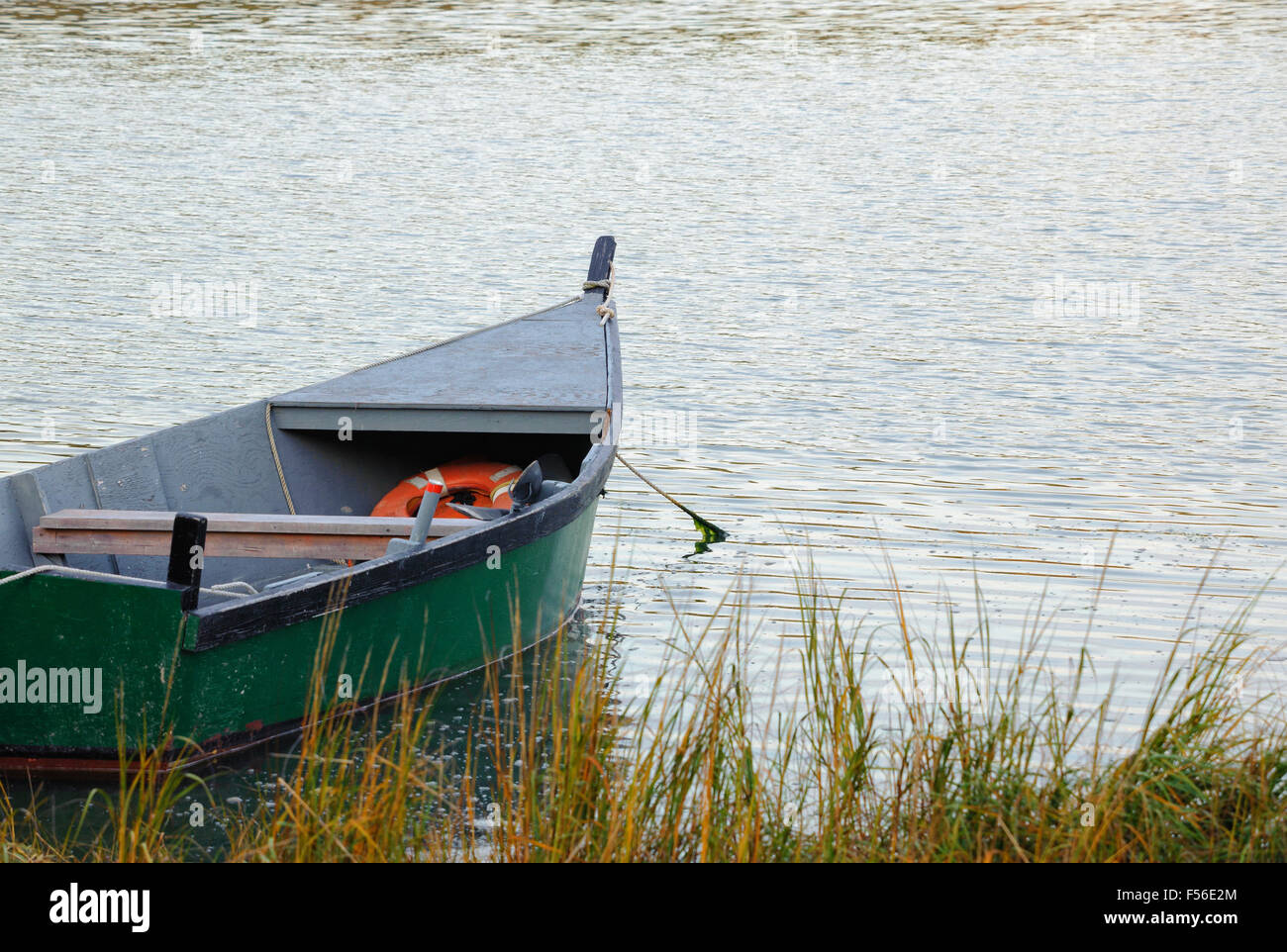 Old wooden boat, Salt Pond, Eastham, Cape Cod, Massachusetts USA in the fall. Autumn travel tourism concept with copy space. Stock Photo