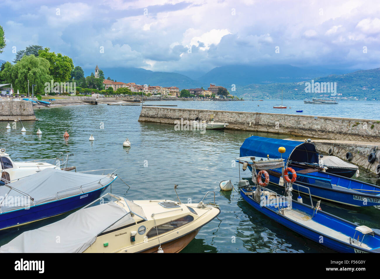 Boats sit in a harbor on Lake Maggiore in summer. Stock Photo