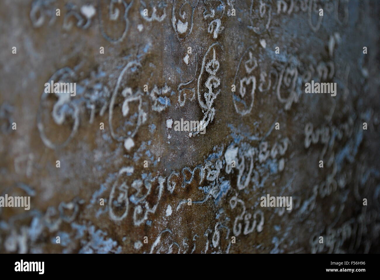 Ancient text in stone wall Stock Photo