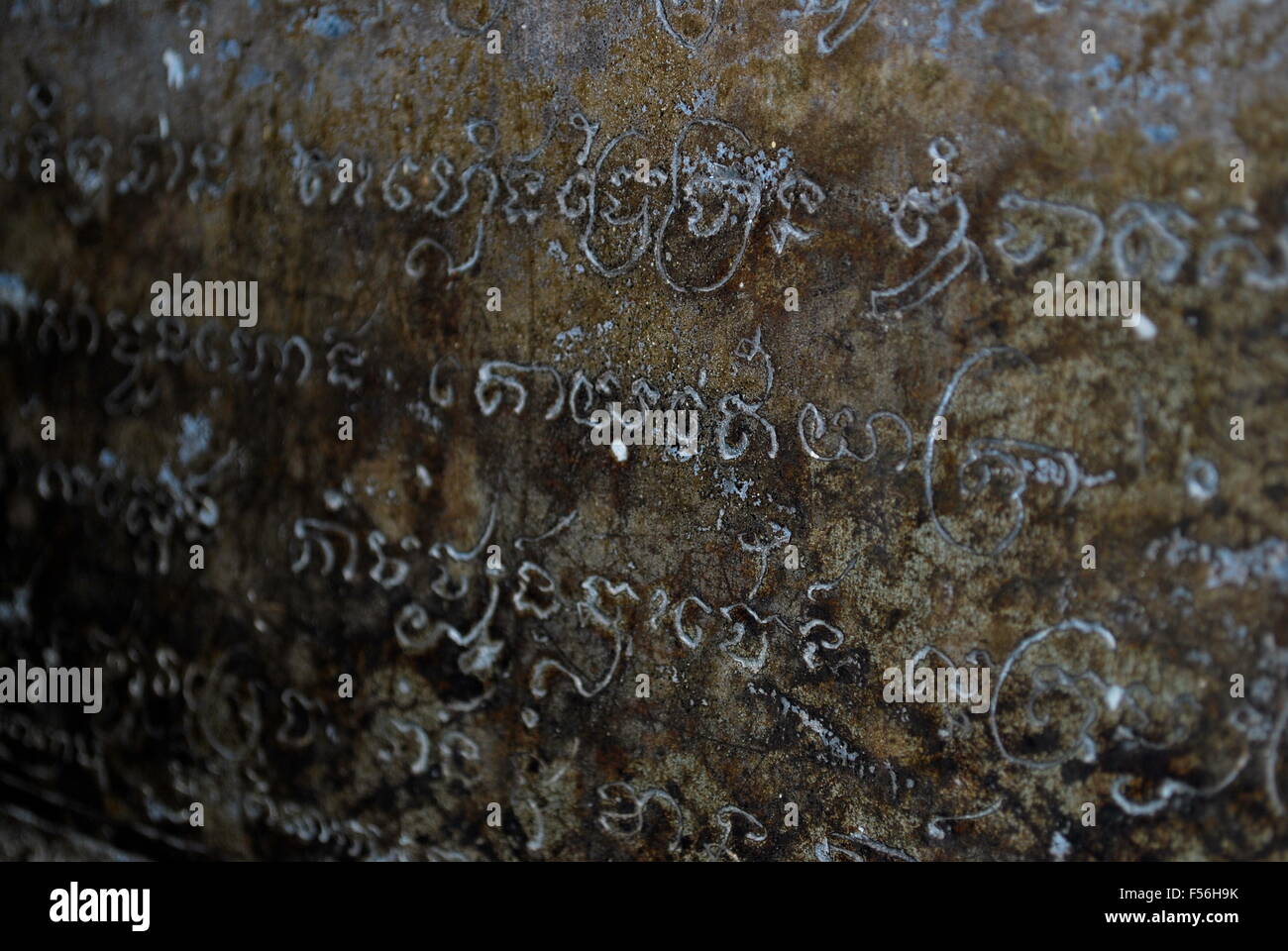 Ancient text in stone wall Stock Photo