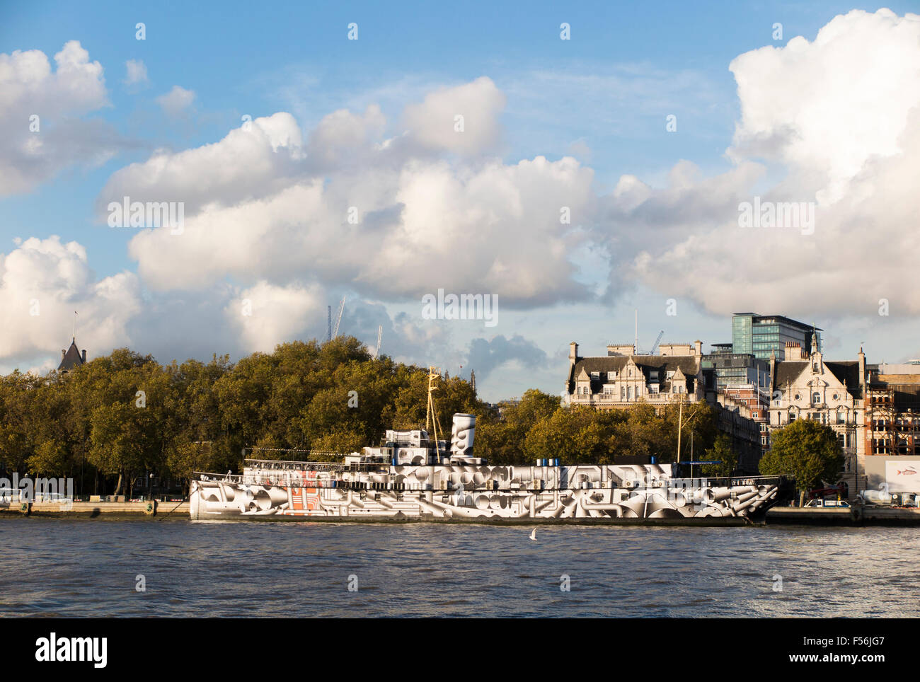 HMS President, a Grimsby Class sloop moored on the Embankment, London, one of three surviving WW1 warships, painted in a dazzle design Stock Photo