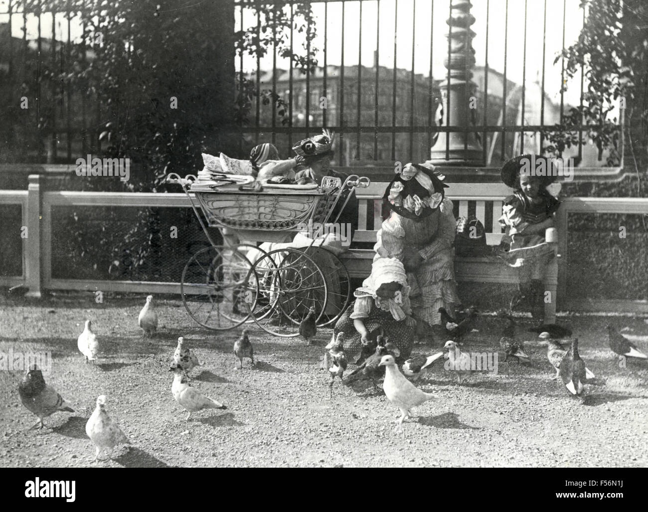 Women and children to feed the pigeons, Denmark Stock Photo