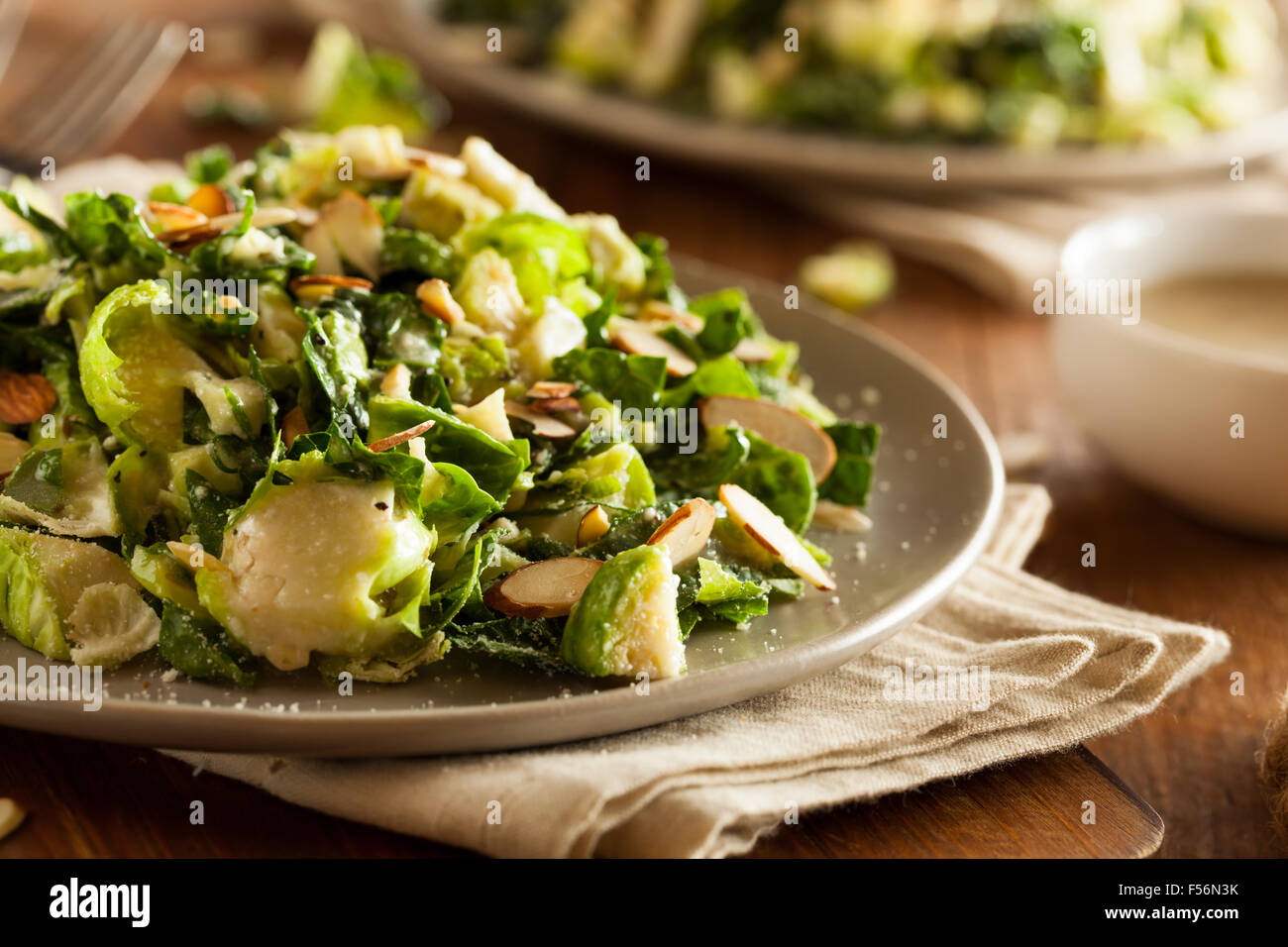 Kale and Brussel Sprout Salad with Almons and Lemon Dressing Stock