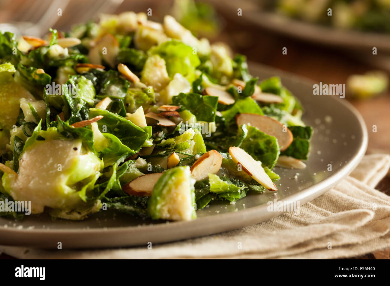 Kale and Brussel Sprout Salad with Almons and Lemon Dressing Stock