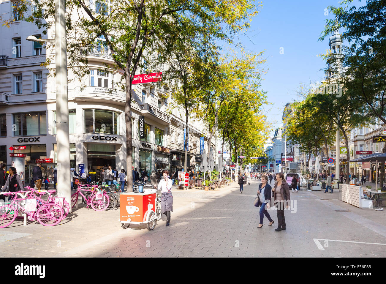 VIENNA, AUSTRIA - OCTOBER 1, 2015: people in shopping area of Mariahilferstrasse street in Vienna. Mariahilfer Strasse is the la Stock Photo