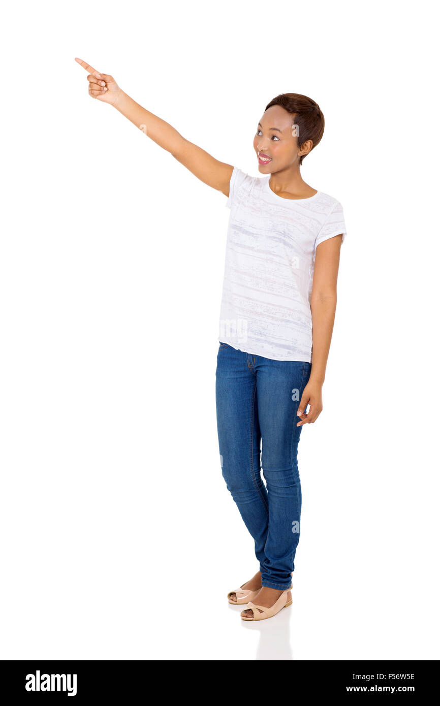 happy African woman pointing at empty space isolated on white ...