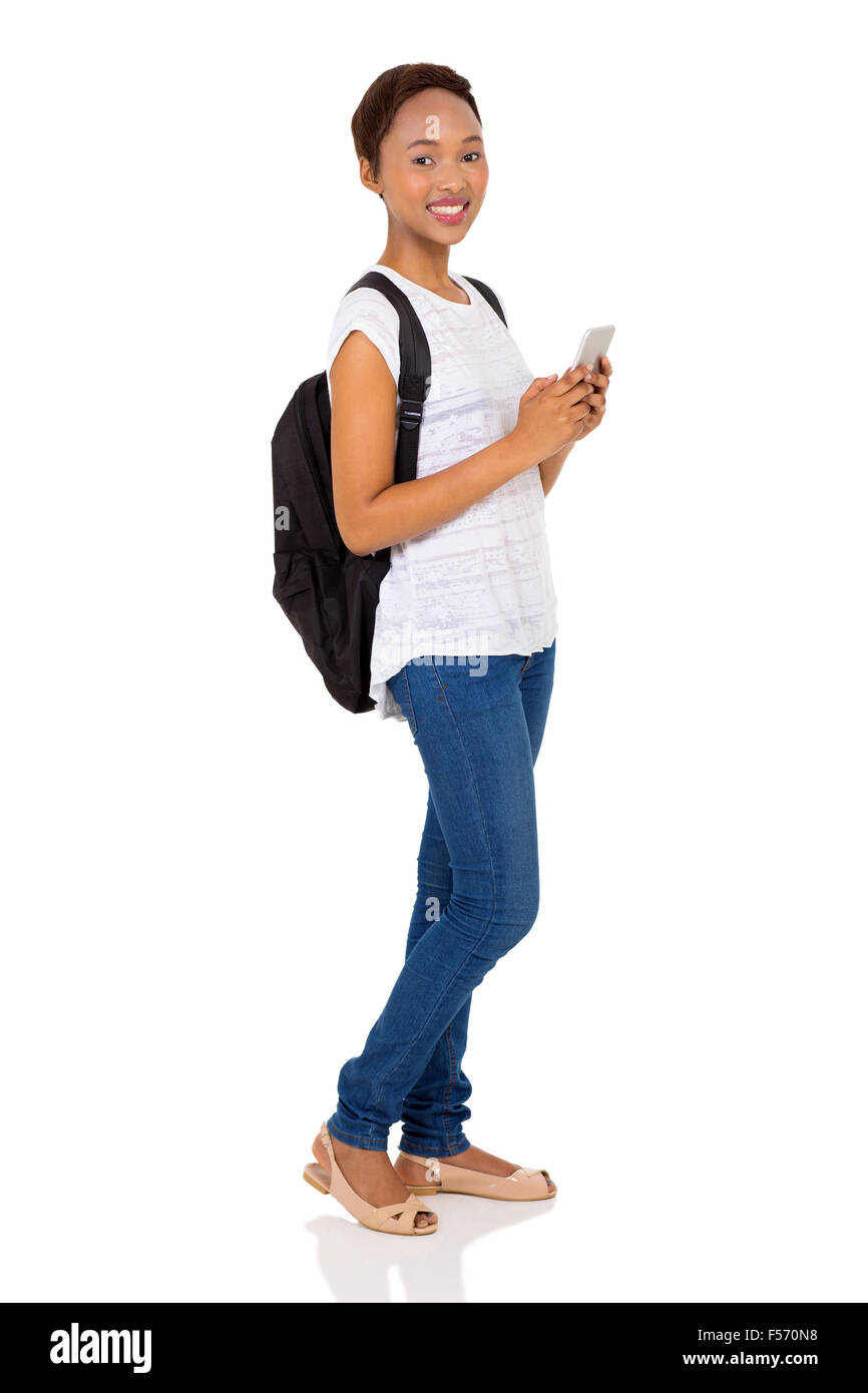 happy female African American college student using mobile phone on white background Stock Photo