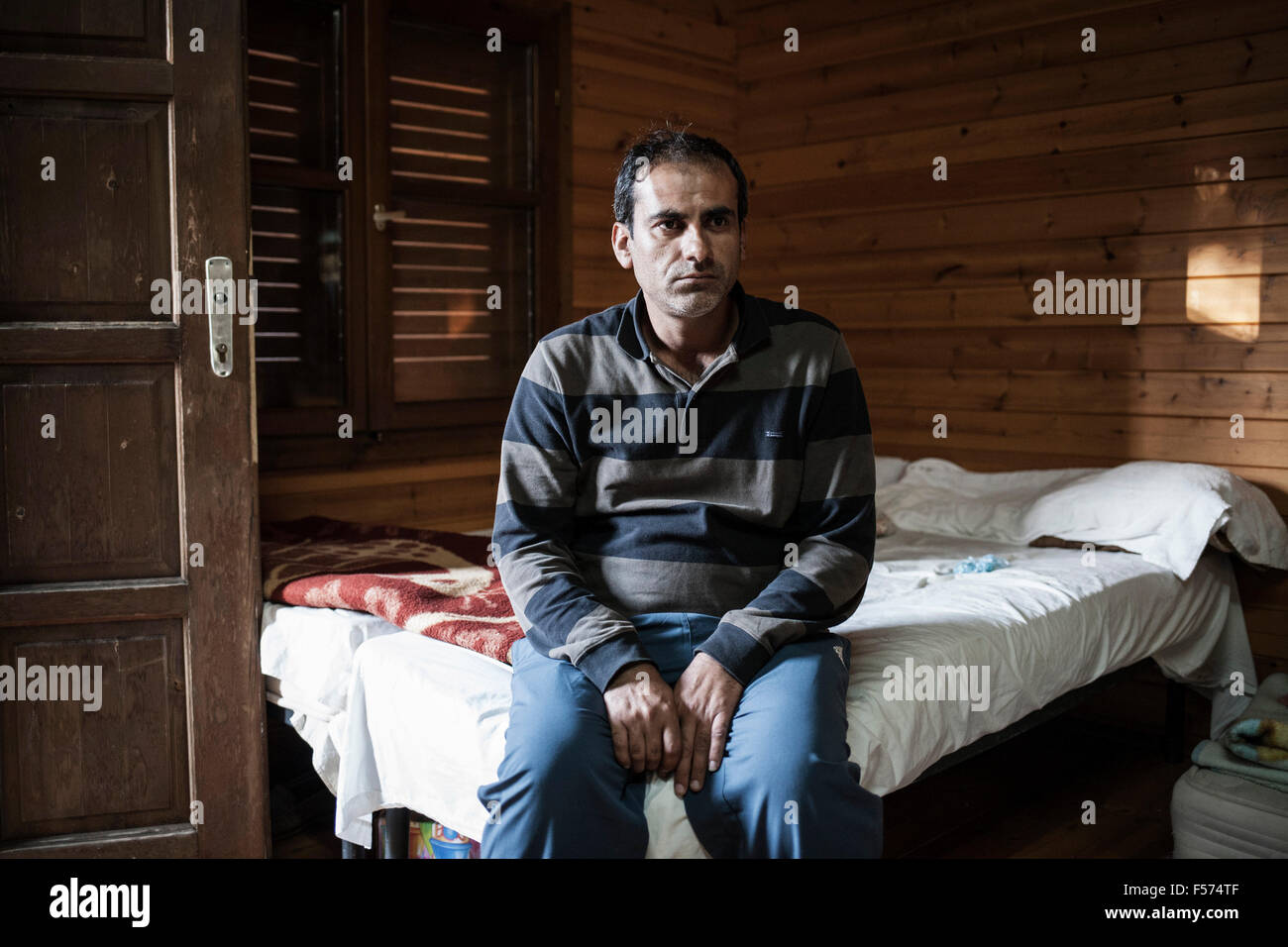 Ahmad Nazad, a 36 years old refugee from Syria, inside Pikpa camp, near the Airport at Mytilene, Lesvos, where volunteers organize a village for traumatized refugees, on the 28th of October 2015. Ahmad lost three of his four children while crossing from the Turkish border to Lesbos, Greece, in a wooden boat. Their boat was hit by a boat of the Greek coast guard and sank. Photo: Socrates Baltagiannis/dpa Stock Photo