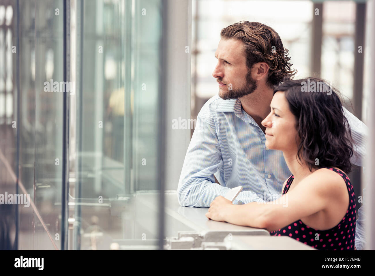 A couple outside a city building Stock Photo - Alamy