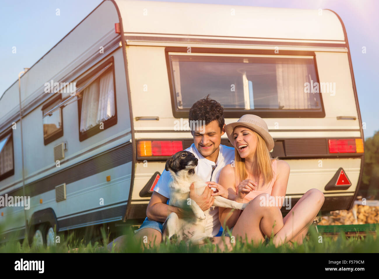 Young couple in front of a camper van Stock Photo - Alamy
