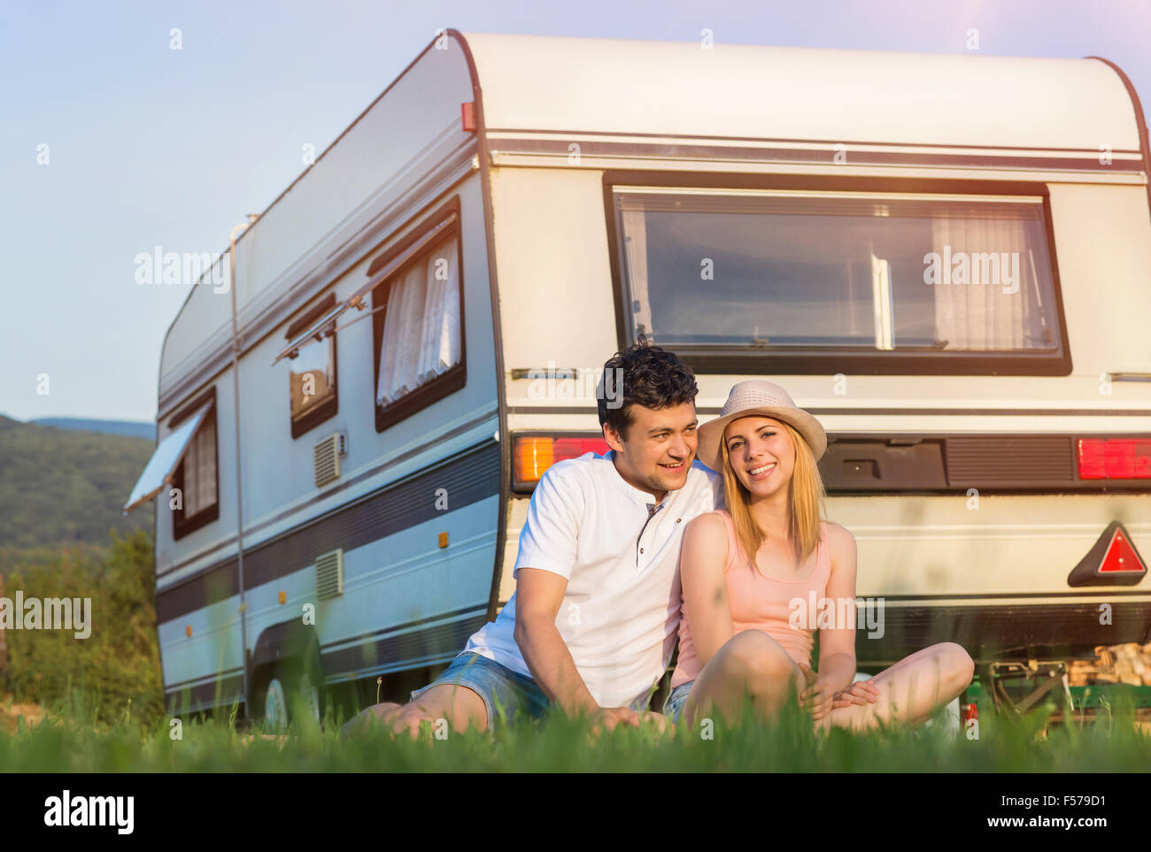 Young couple in front of a camper van Stock Photo - Alamy