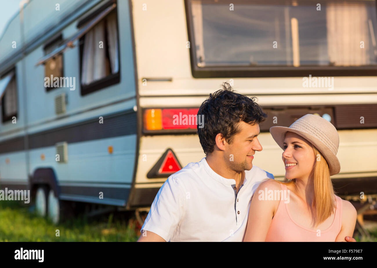 Young couple in front of a camper van Stock Photo - Alamy