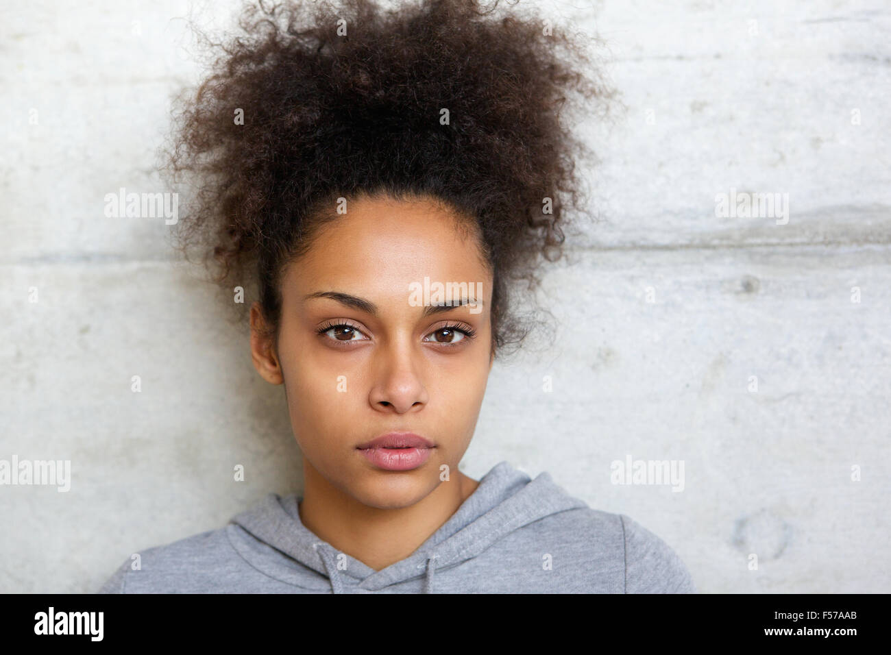 Close up portrait of an attractive african american woman looking at ...