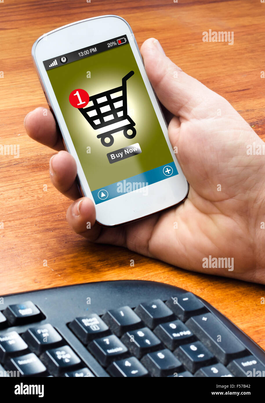 hand holding on smartphone with a online shooping (buy button on the screen) Stock Photo