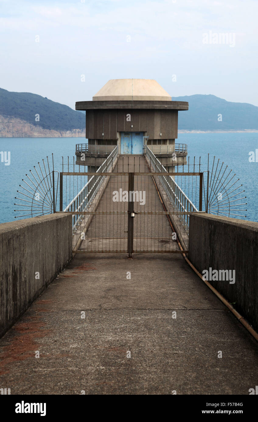 It's a photo of a tower in a water reservoir. it is to regulate the water level of the tank. It has a bridge to access to it Stock Photo