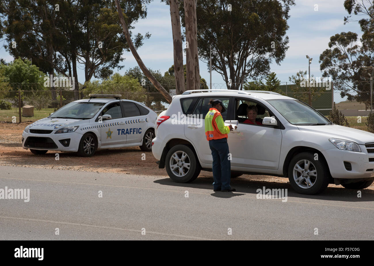 Traffic police taking driver details on roadside during a road block set up in Wellington Western Cape South Africa Stock Photo