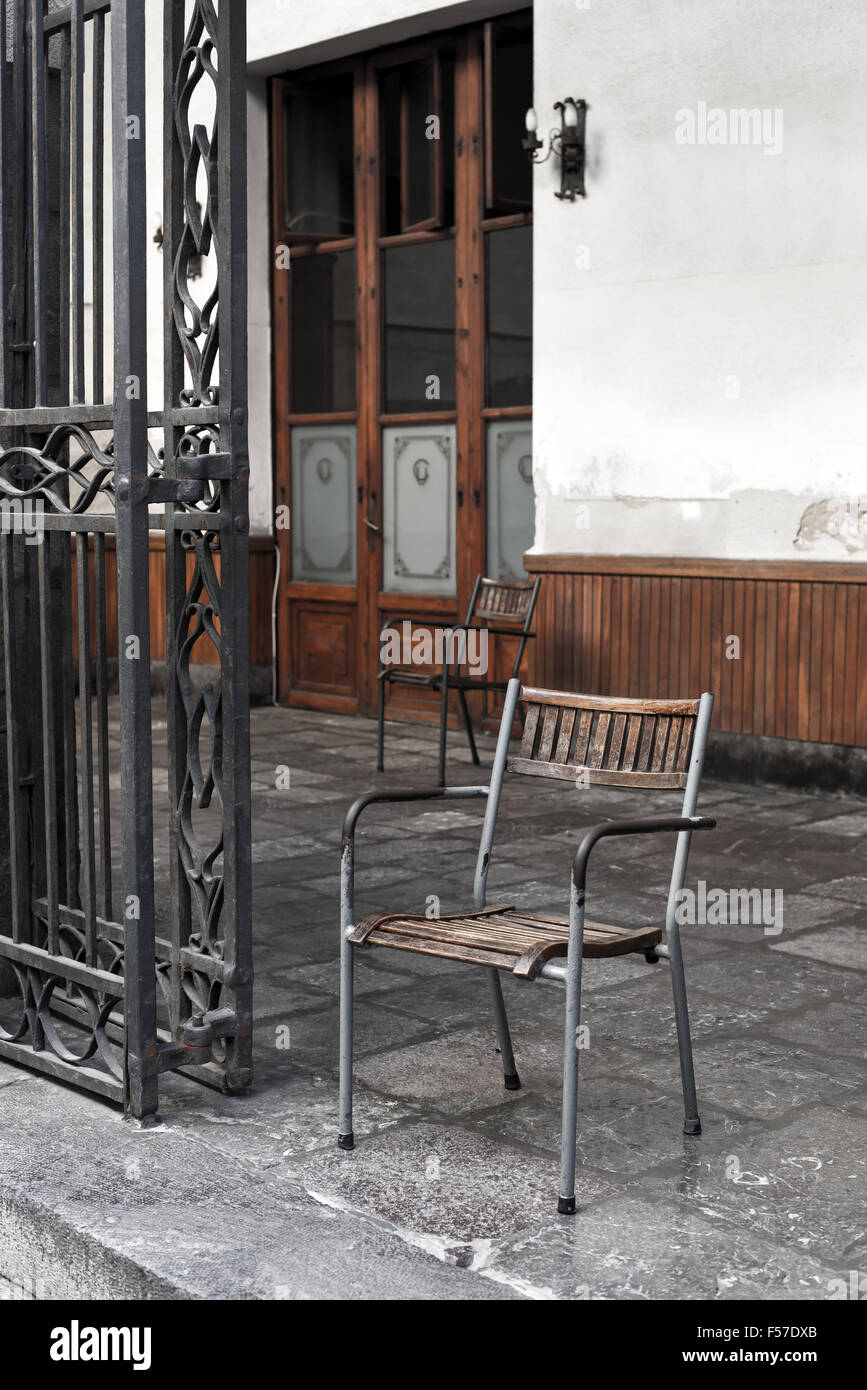 Vintage wooden and iron chair in a porch. European style Stock Photo