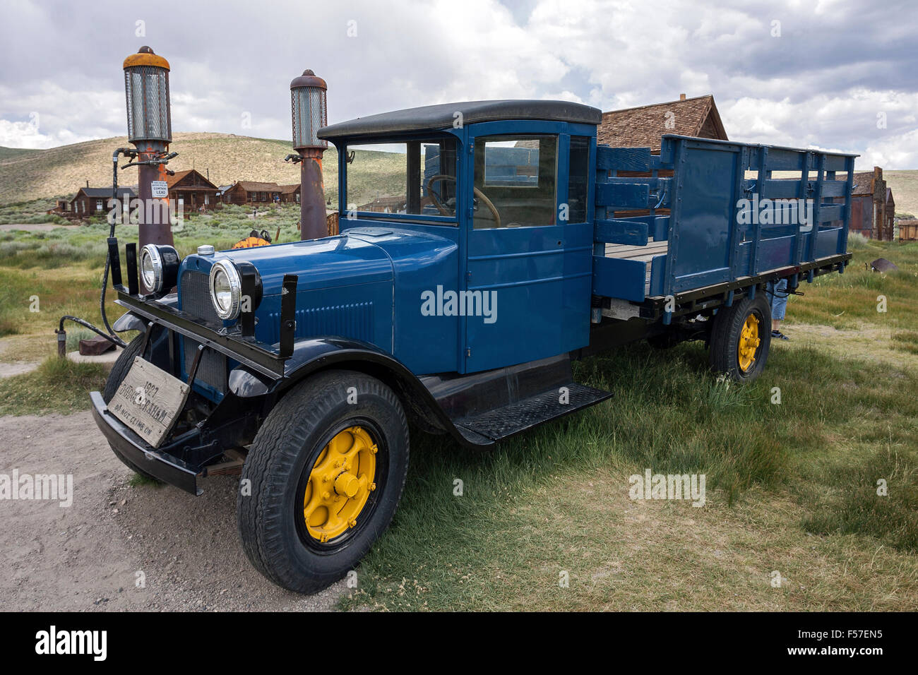 Vintage Truck Dodge Graham, built in 1927, parked at an old gas station, behind old wooden houses, ghost town Stock Photo