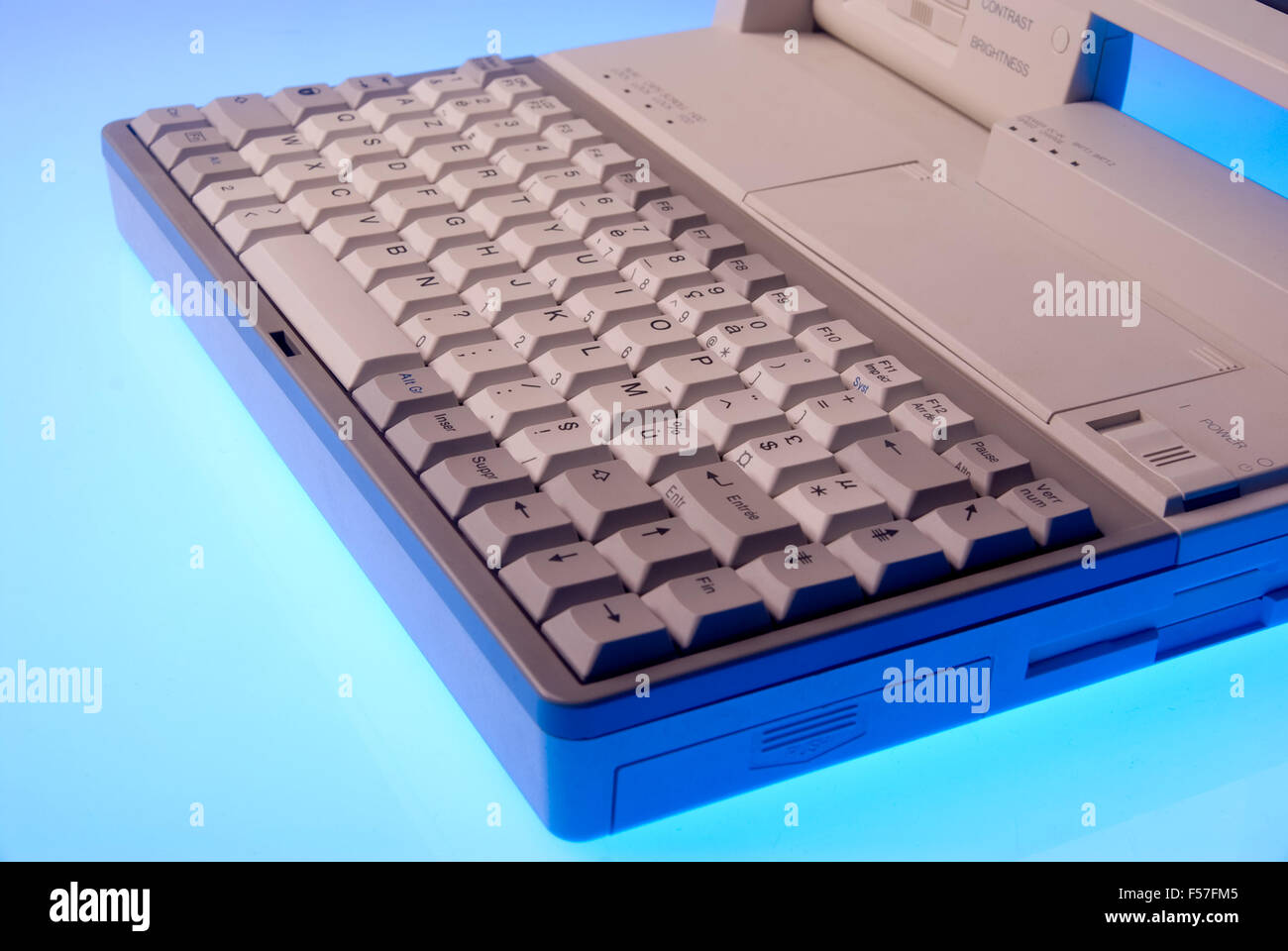 azerty laptop keyboard in blue light Stock Photo