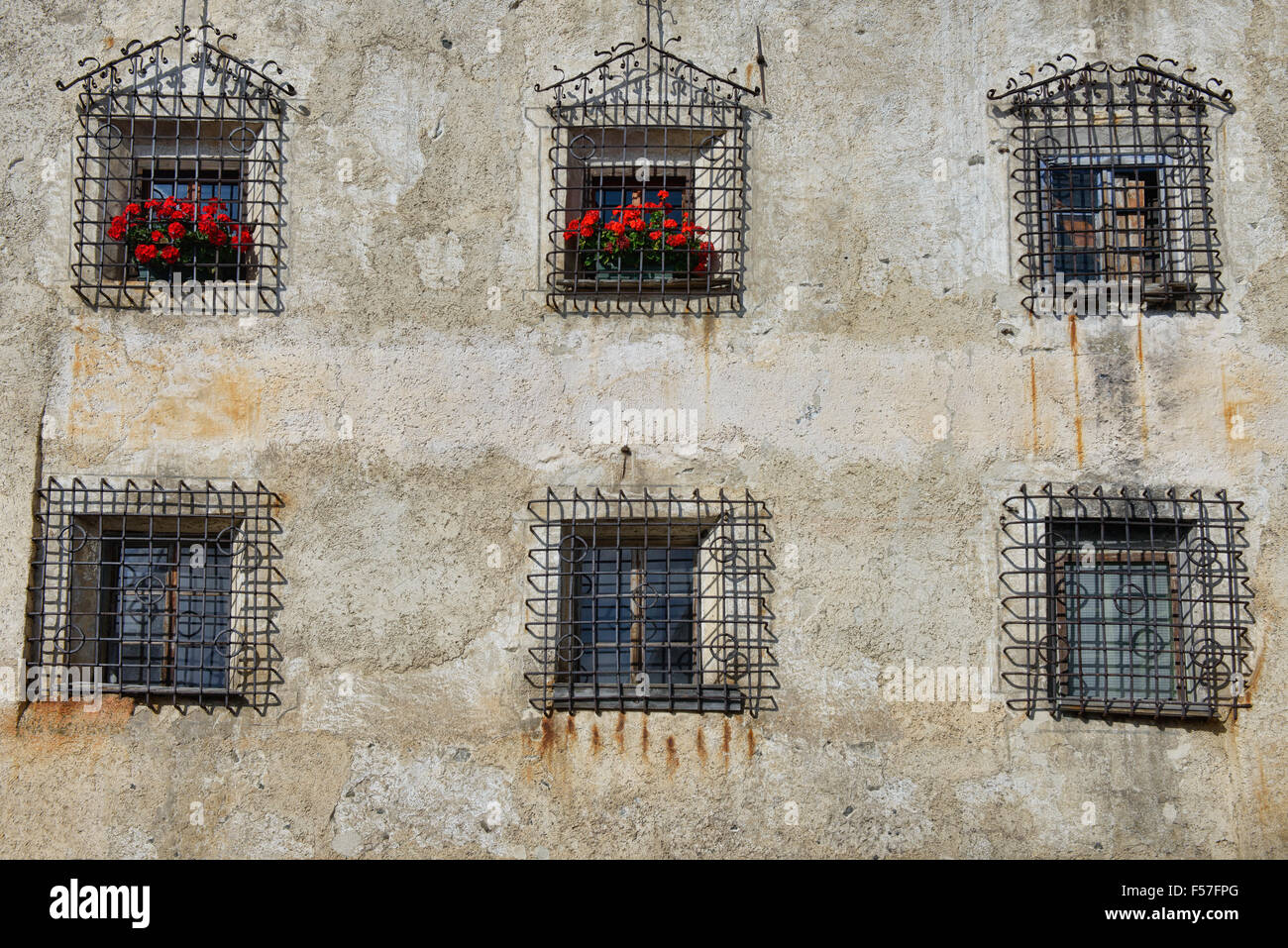 Windows on the 1636 Casa Chizzali Bonfadini house in Colle Santa Lucia in the Dolomites, Italy Stock Photo