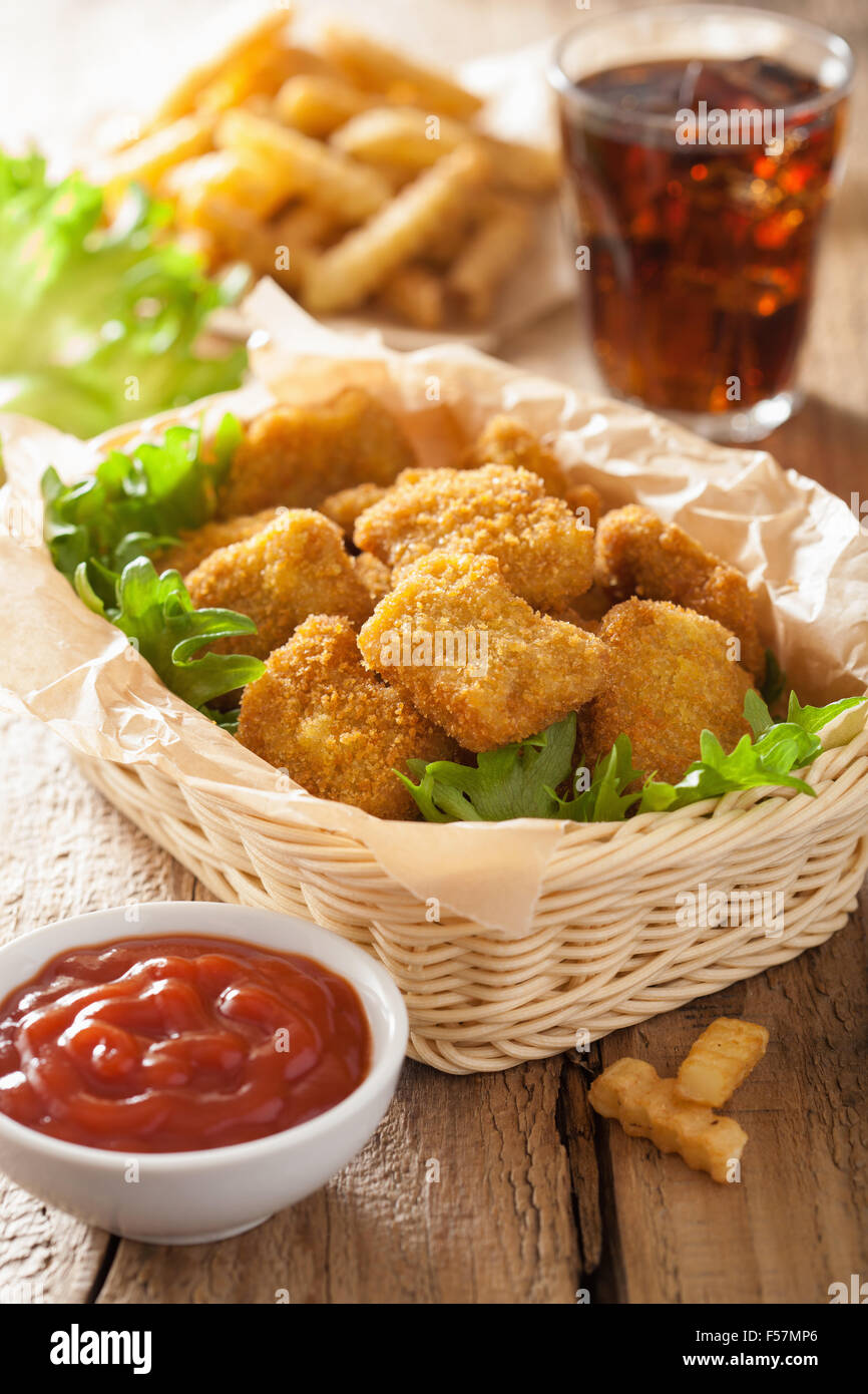 fast food chicken nuggets with ketchup, french fries, cola Stock Photo