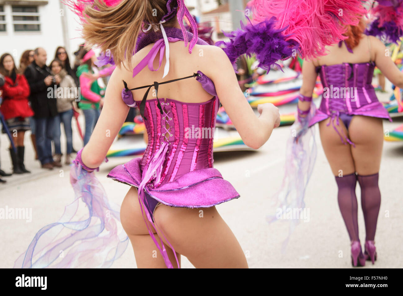 Women dancing in Mealhada Carnaval parade -Samba group Grupo Socios da Mangueira costume -  'Ultraviolet radiation -Tudo o que ves é luz' Stock Photo