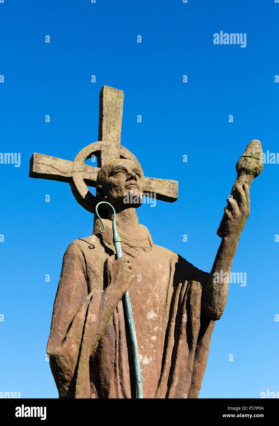 Statue of St Aidan (by sculptor Kathleen Parbury) in the grounds of Lindisfarne Priory, Holy Island, Northumberland, England, UK Stock Photo
